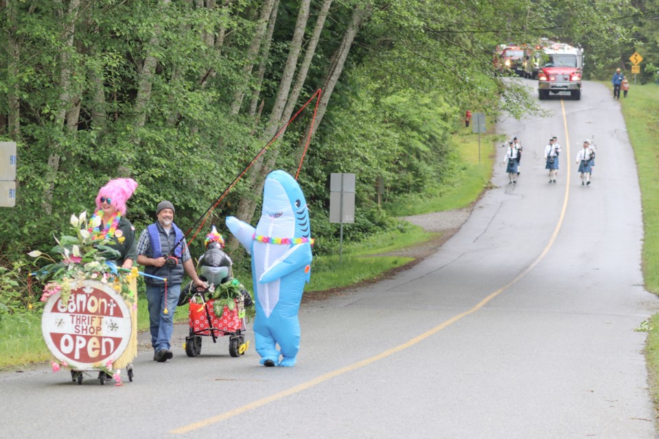 The parade started at 11 a.m. The Egmont Thrift Shop float started at the bottom of the hill because everyone knows sharks can't climb hills. 